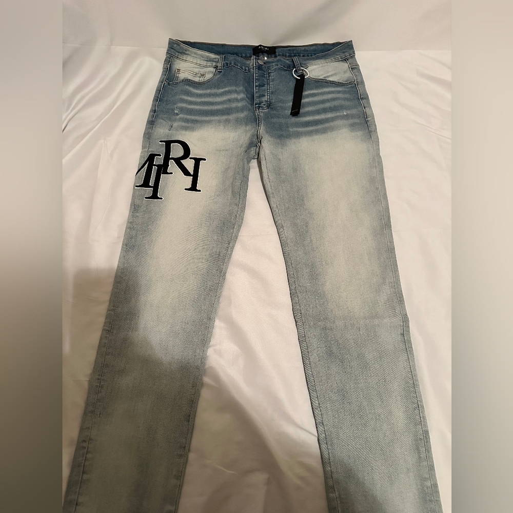 AMIRI Faded Blue Slim Jeans with Black Logo